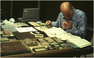 Nadav Na'aman examining tablet samples