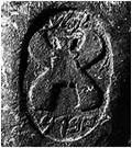 Fig. 24. A lmlk seal impression with a four-winged emblem