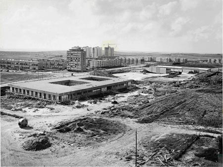 The expansion of the campus with the Gilman Building under construction